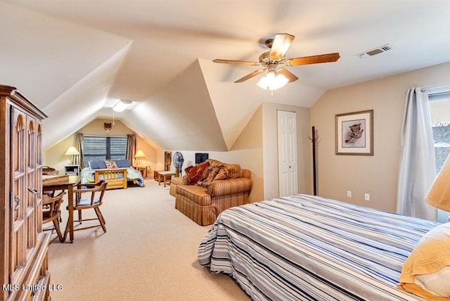 carpeted bedroom featuring ceiling fan, a closet, and lofted ceiling