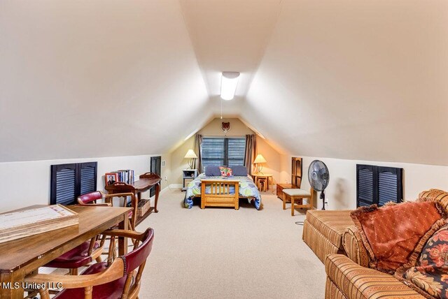 carpeted bedroom featuring vaulted ceiling