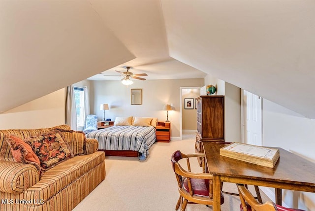 bedroom with lofted ceiling, ceiling fan, and carpet flooring