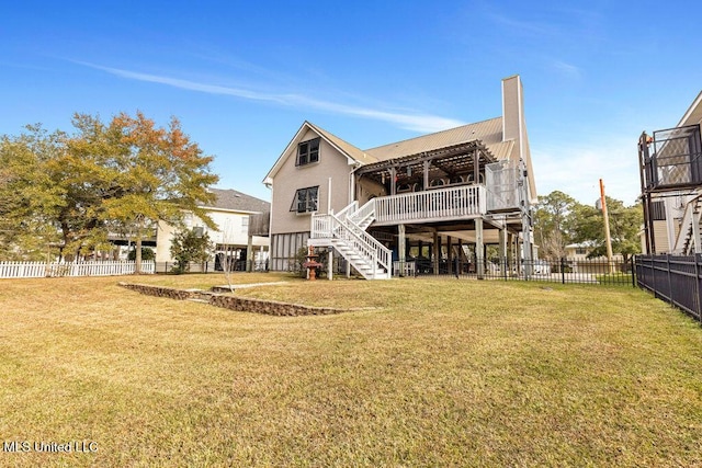 back of house featuring a lawn