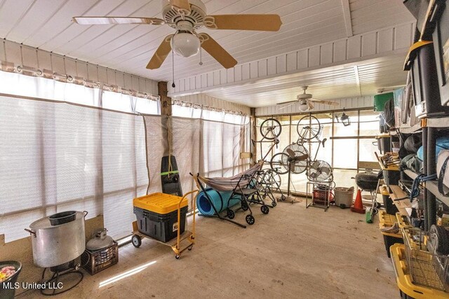 interior space with ceiling fan