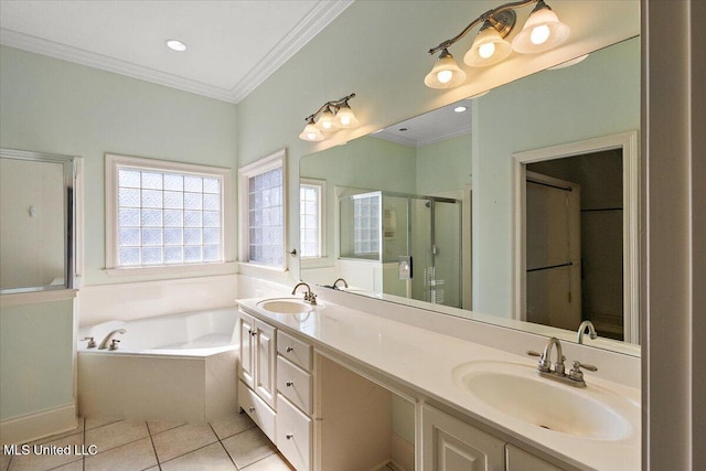 bathroom featuring tile patterned flooring, crown molding, a sink, and a shower stall