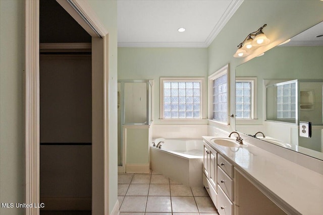 bathroom with tile patterned flooring, vanity, ornamental molding, a shower stall, and a bath