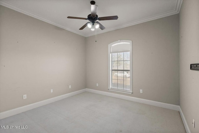 empty room with light carpet, crown molding, baseboards, and ceiling fan