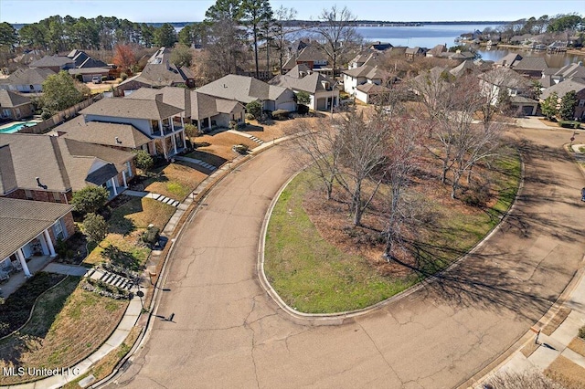 bird's eye view featuring a residential view and a water view