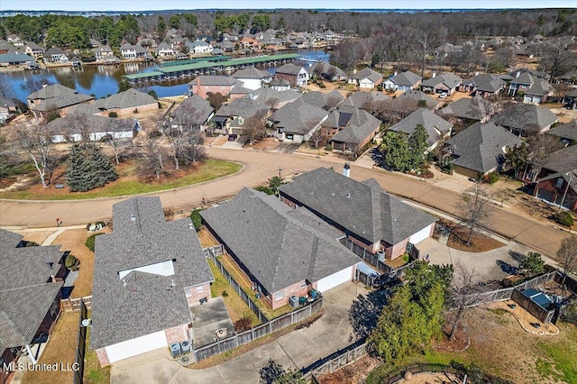 birds eye view of property featuring a residential view and a water view