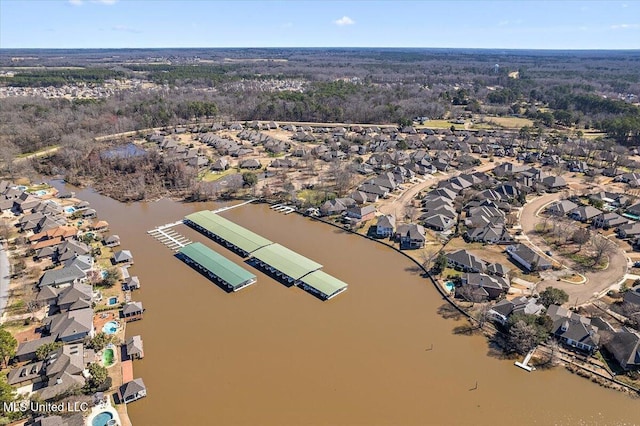 birds eye view of property with a residential view and a water view