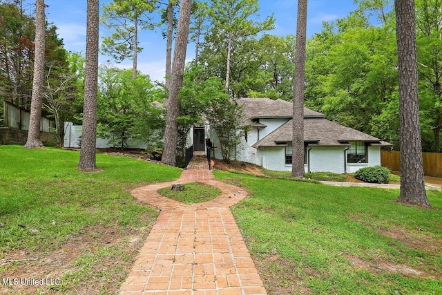 view of front of house with a front lawn