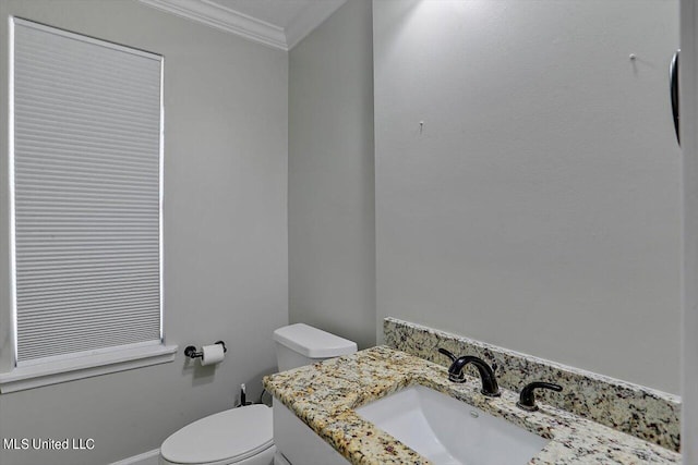 4441 Wedgewood St, Jackson, MS 39211 - half bathroom featuring crown molding, toilet, baseboards, and vanity