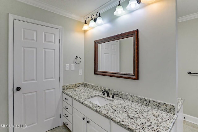 bathroom featuring vanity, crown molding, and tile patterned flooring