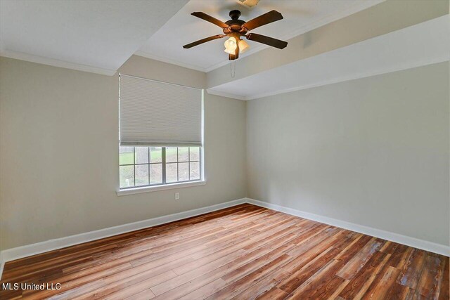 spare room featuring ornamental molding, hardwood / wood-style flooring, and ceiling fan