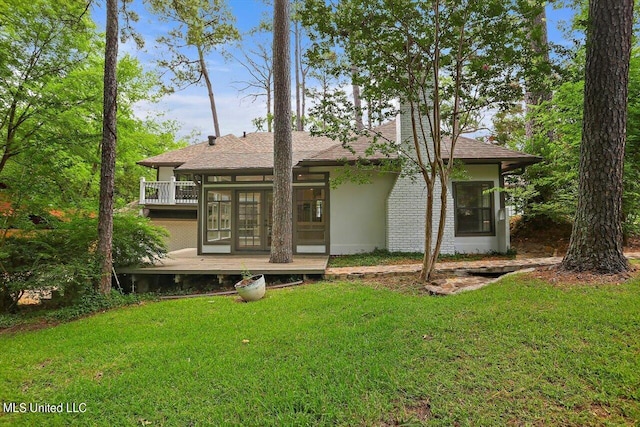 4441 Wedgewood St, Jackson, MS 39211 - back of property with a yard, stucco siding, and a deck