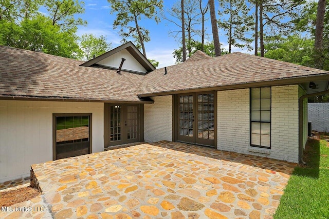 4441 Wedgewood St, Jackson, MS 39211 - exterior space with a shingled roof, a patio, french doors, and brick siding