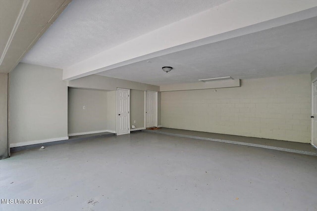 basement featuring a textured ceiling