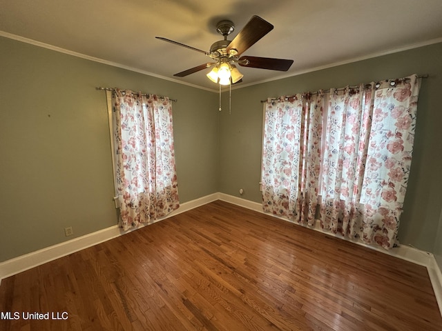 spare room with hardwood / wood-style flooring, ceiling fan, and ornamental molding