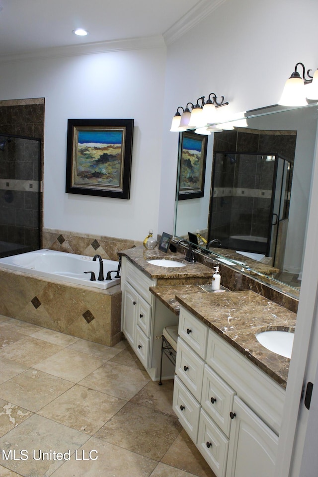 bathroom featuring a bath, a stall shower, crown molding, and vanity