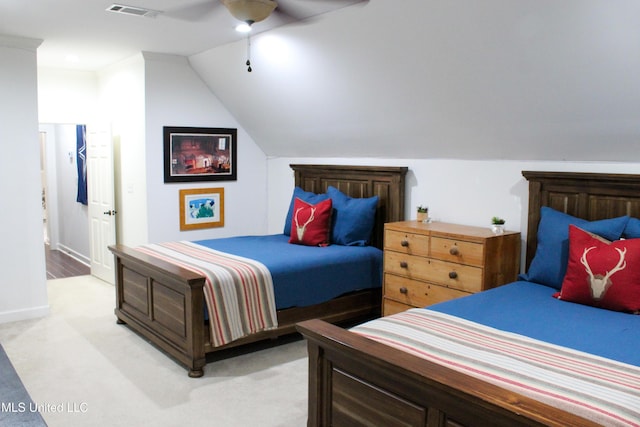 bedroom with light carpet, visible vents, baseboards, lofted ceiling, and ceiling fan