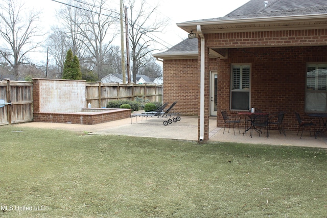 view of yard featuring a patio and fence