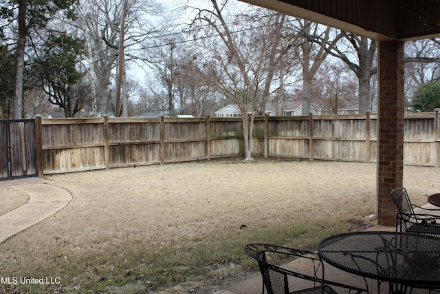 view of yard featuring a patio area and fence