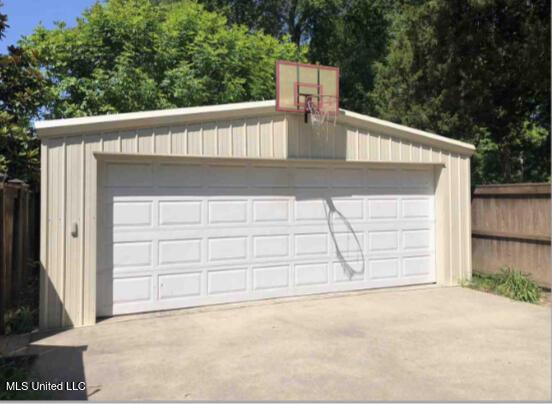 detached garage with fence