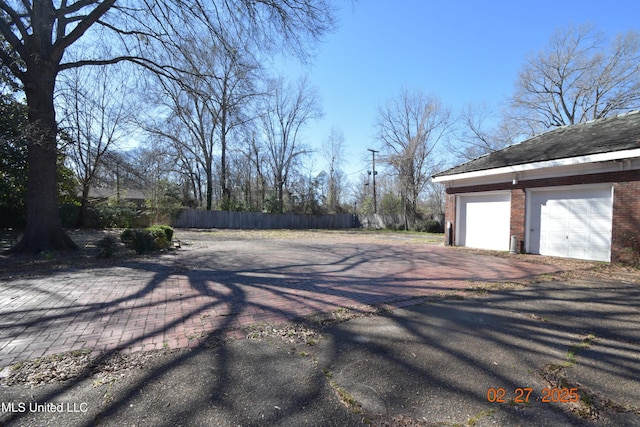 view of street featuring aphalt driveway