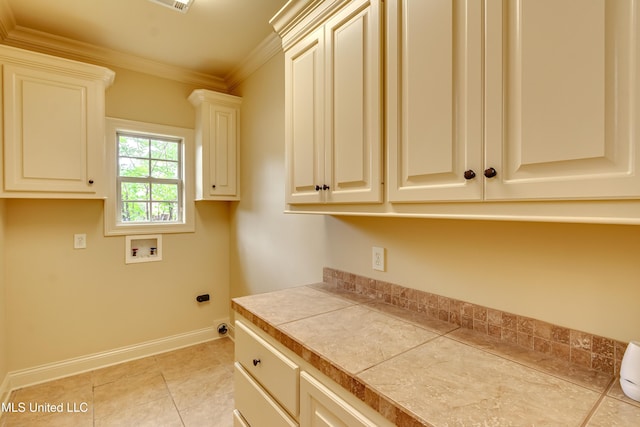 104 Faith Way, Brandon, MS 39042 - clothes washing area with hookup for a washing machine, cabinet space, baseboards, ornamental molding, and light tile patterned flooring