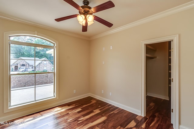 104 Faith Way, Brandon, MS 39042 - spare room featuring dark wood-style flooring, baseboards, crown molding, and ceiling fan