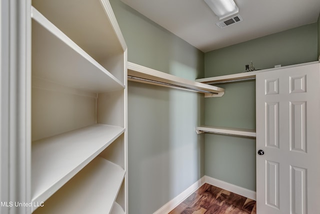104 Faith Way, Brandon, MS 39042 - spacious closet featuring dark wood-type flooring