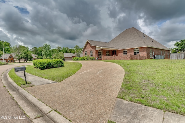 104 Faith Way, Brandon, MS 39042 - view of front facade featuring brick siding, a front lawn, and central air condition unit