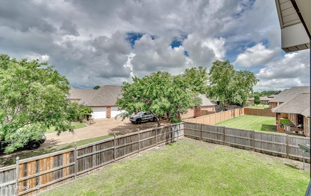 104 Faith Way, Brandon, MS 39042 - view of yard with a garage, concrete driveway, and a residential view