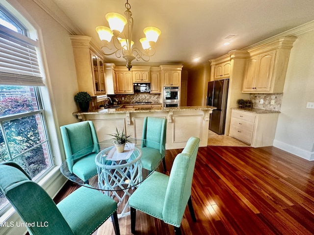 104 Faith Way, Brandon, MS 39042 - dining area with a chandelier, light wood-style flooring, and baseboards