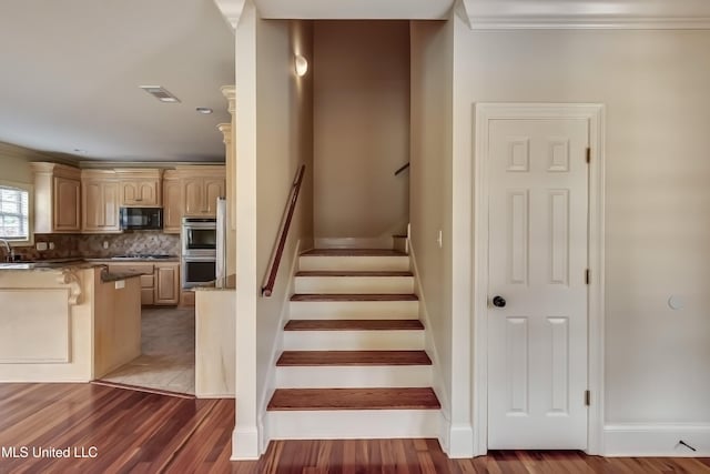 104 Faith Way, Brandon, MS 39042 - stairs featuring crown molding, wood finished floors, and baseboards