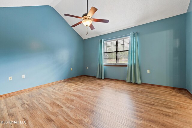 7300 Frank Snell Rd, Moss Point, MS 39562 - spare room featuring lofted ceiling, ceiling fan, and wood finished floors