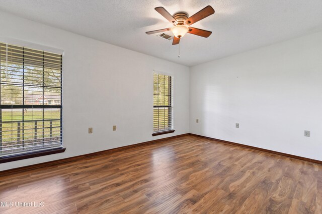 7300 Frank Snell Rd, Moss Point, MS 39562 - empty room featuring wood finished floors, a ceiling fan, and baseboards