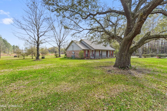 7300 Frank Snell Rd, Moss Point, MS 39562 - view of grassy yard with covered porch