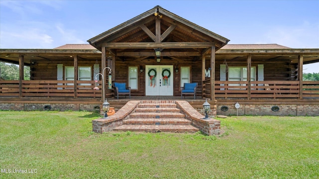 438 John Ford Home Rd, Sandy Hook, MS 39478 - view of front of home featuring log siding and a front lawn