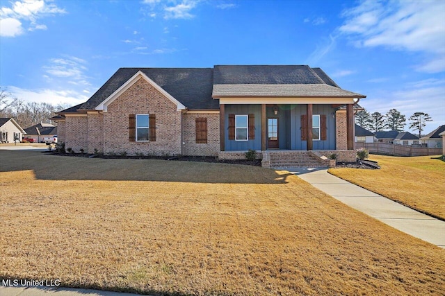 view of front of home featuring a porch and a front yard