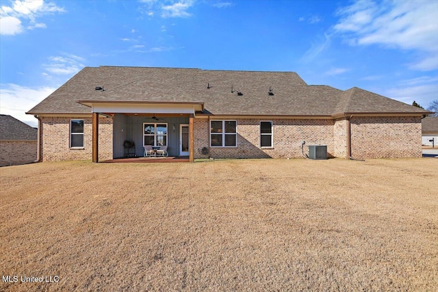 back of house with central AC and ceiling fan