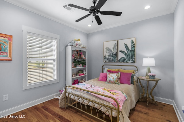 bedroom with dark hardwood / wood-style flooring, crown molding, and ceiling fan