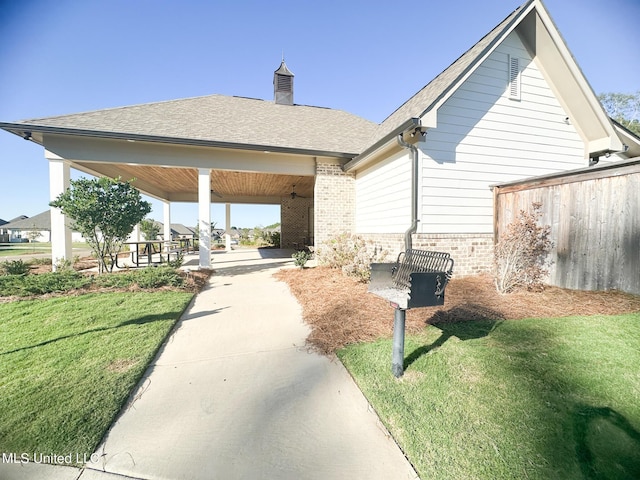 exterior space with a yard and a gazebo