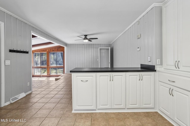 5360 Wayneland Dr, Jackson, MS 39211 - kitchen featuring visible vents, a ceiling fan, dark countertops, a peninsula, and light tile patterned flooring