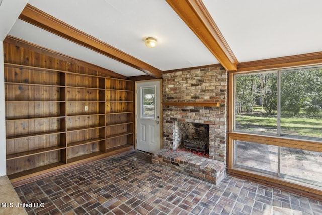 5360 Wayneland Dr, Jackson, MS 39211 - unfurnished living room featuring brick floor and lofted ceiling with beams