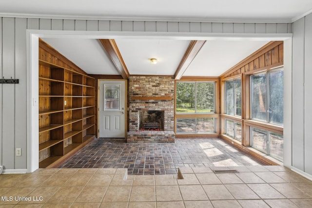 5360 Wayneland Dr, Jackson, MS 39211 - unfurnished living room with built in features, visible vents, wooden walls, and lofted ceiling with beams