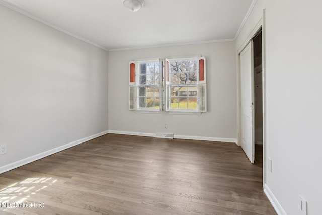 5360 Wayneland Dr, Jackson, MS 39211 - unfurnished bedroom with visible vents, baseboards, and wood finished floors