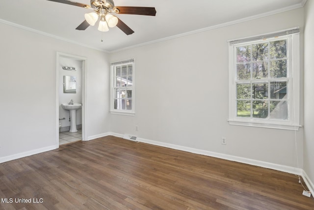 5360 Wayneland Dr, Jackson, MS 39211 - empty room featuring a wealth of natural light, ornamental molding, a ceiling fan, and a sink