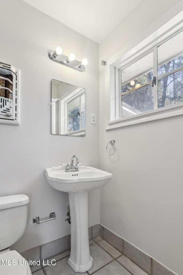 5360 Wayneland Dr, Jackson, MS 39211 - bathroom with baseboards, toilet, and tile patterned flooring