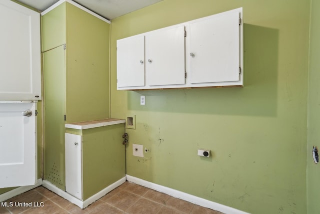 5360 Wayneland Dr, Jackson, MS 39211 - laundry room featuring electric dryer hookup, cabinet space, light tile patterned flooring, baseboards, and hookup for a washing machine