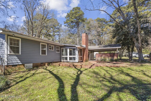 5360 Wayneland Dr, Jackson, MS 39211 - rear view of house with fence, a lawn, a chimney, a sunroom, and crawl space