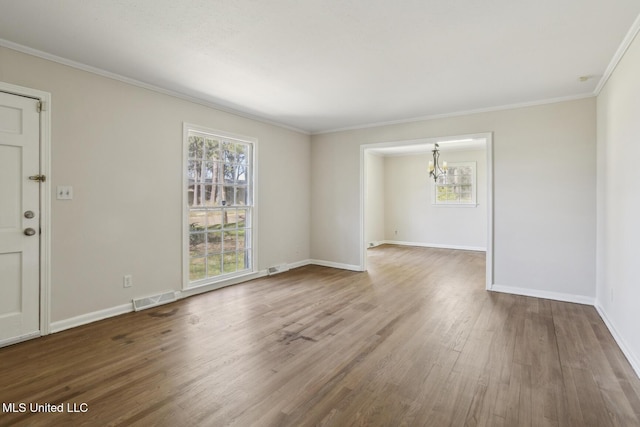 5360 Wayneland Dr, Jackson, MS 39211 - interior space featuring visible vents, wood finished floors, an inviting chandelier, crown molding, and baseboards