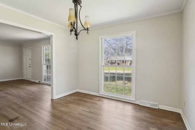 5360 Wayneland Dr, Jackson, MS 39211 - unfurnished dining area with visible vents, a healthy amount of sunlight, ornamental molding, and wood finished floors
